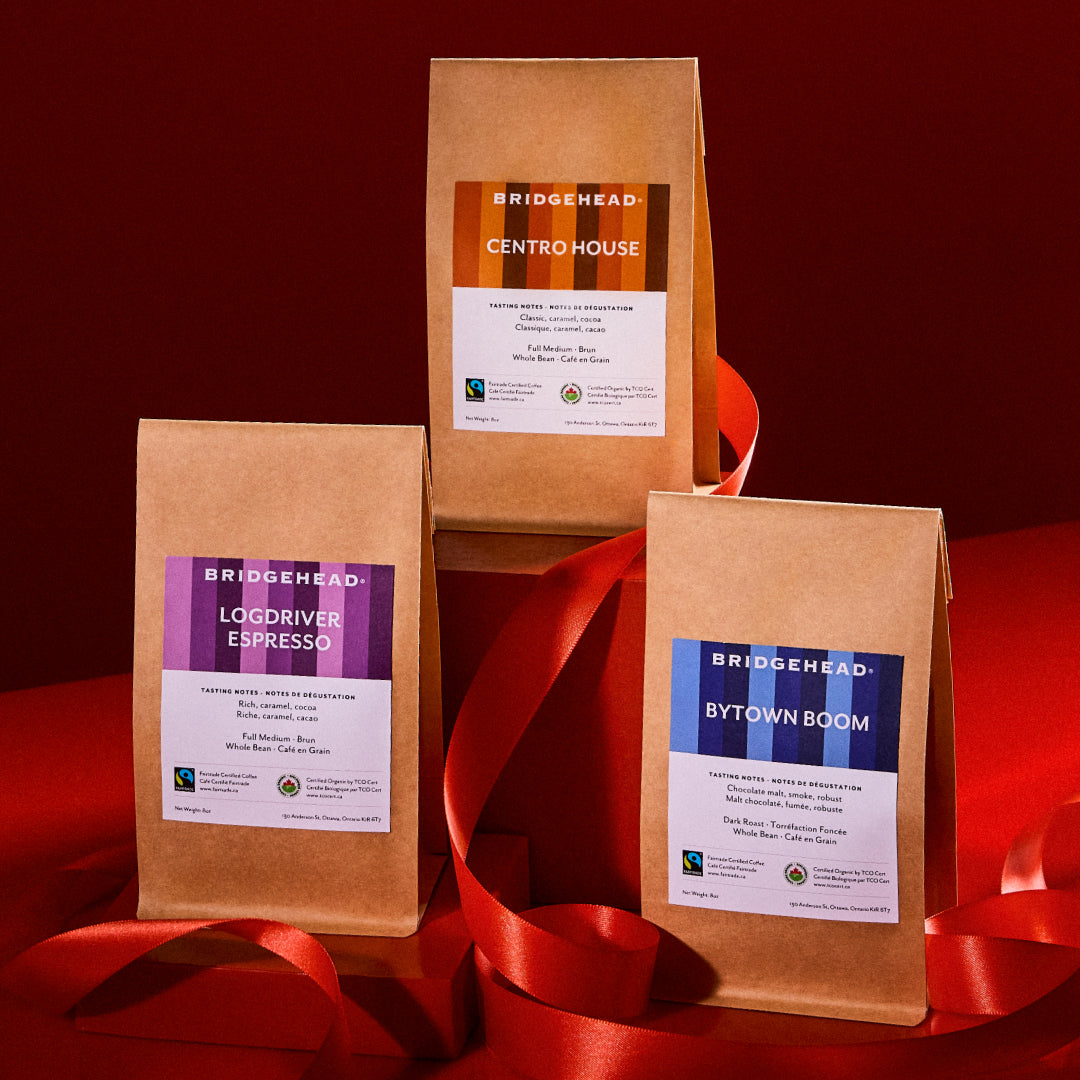 gift set of three 8oz bags of Centro House, Logdriver Espresso and Bytown Boom. Surrounded by a red ribbon